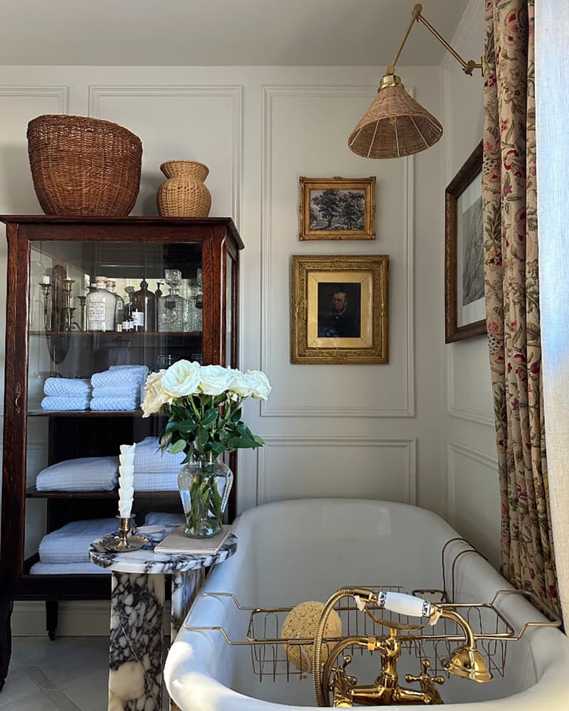 Wicker sconce in newly renovated bathroom.