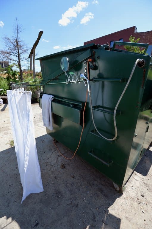An outdoor shower on the home Greg Kloehn made from a $1,000 trash dumpster, on August 15, 2013 in New York. His dumpster home has flashes of luxury, with granite counter tops and a hardwood floor
