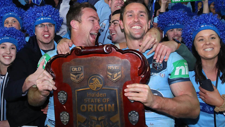 James Maloney and Mitchell Pearce celebrate with the State of Origin shield. (Photo by Cameron Spencer/Getty Images)