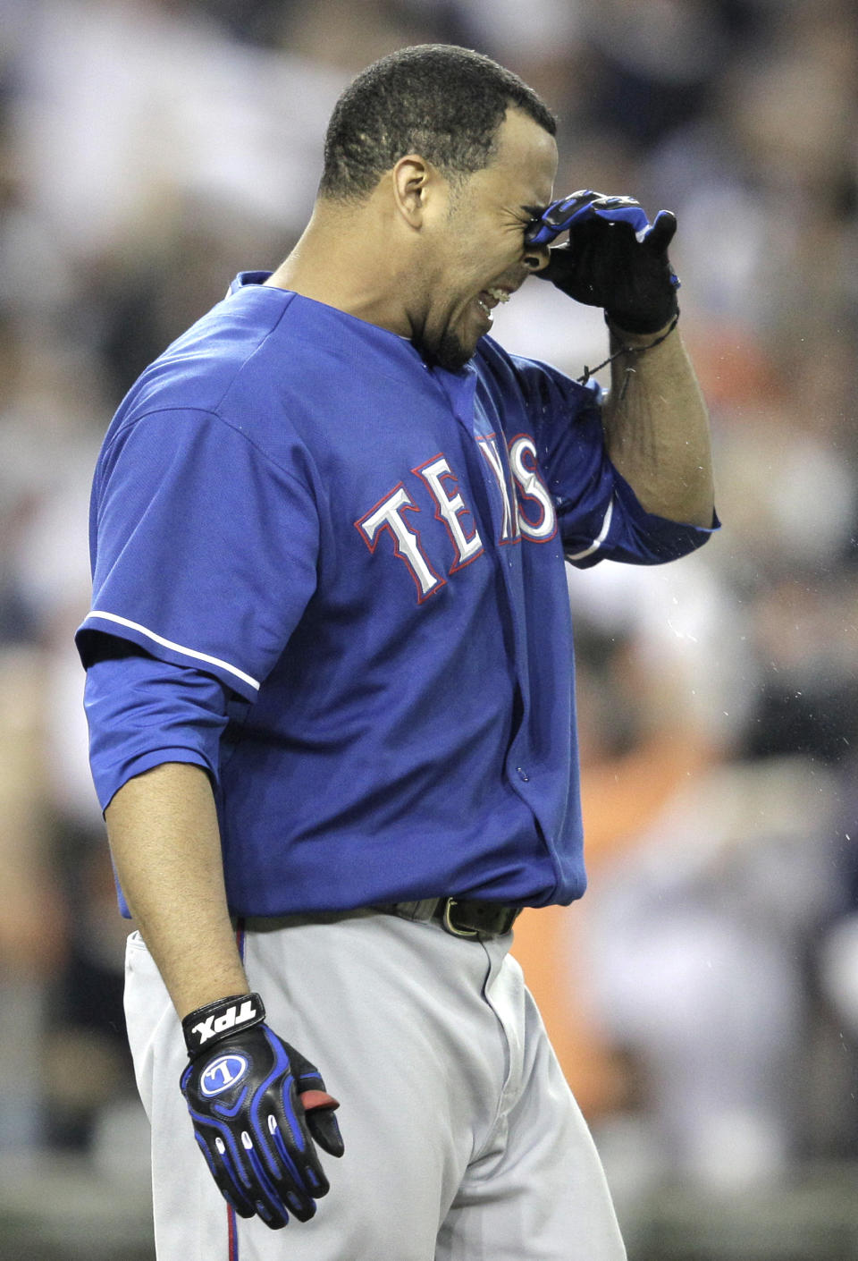 Texas Rangers' Nelson Cruz reacts after striking out in the seventh inning of Game 3 of baseball's American League championship series against the Detroit Tigers, Tuesday, Oct. 11, 2011, in Detroit. (AP Photo/Charlie Riedel)
