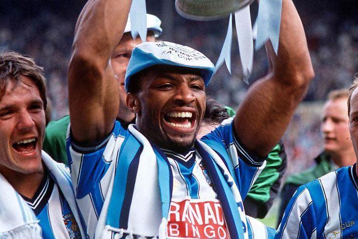 Trailblazer: Cyrille Regis celebrates winning the FA Cup in 1987 with Coventry City