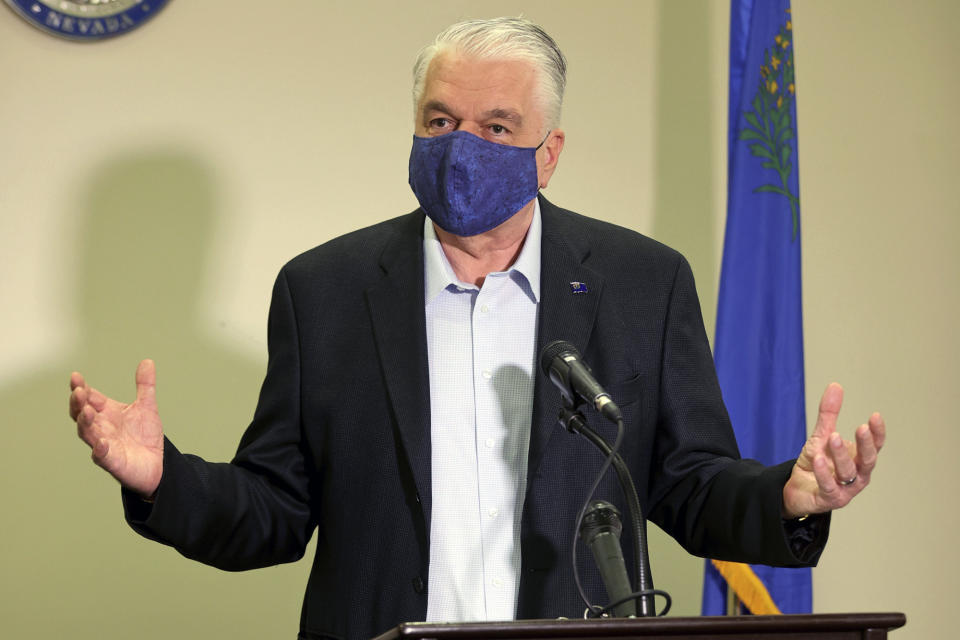 FILE - In this Friday, Oct. 2, 2020 file photo Nevada Gov. Steve Sisolak updates the state's COVID-19 response during a news conference at the Sawyer Building in Las Vegas. Nevada Gov. Steve Sisolak said that he had tested positive for COVID-19 on Friday, Nov. 13, 2020 as the virus surges to record levels in Nevada and throughout the United States.(K.M. Cannon/Las Vegas Review-Journal via AP, Pool, File)