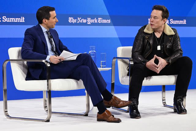 <p>Slaven Vlasic/Getty</p> Andrew Ross Sorkin and Elon Musk speak onstage during The New York Times Dealbook Summit 2023 at Jazz at Lincoln Center on November 29, 2023 in New York City.