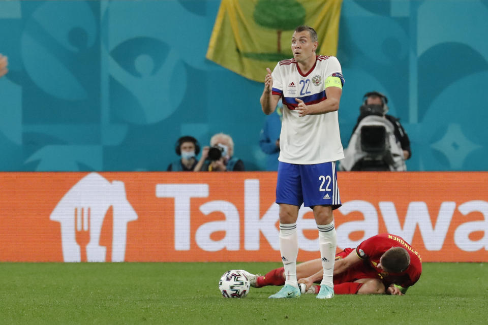 Russia's Artem Dzyuba reacts during the Euro 2020 soccer championship group B match between Belgium and Russia at the Saint Petersburg stadium in St. Petersburg, Russia, Saturday, June 12, 2021. (Anatoly Maltsev/Pool via AP)