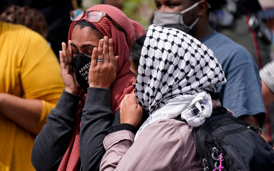 A woman reacts to news in the Breonna Taylor shooting - AP