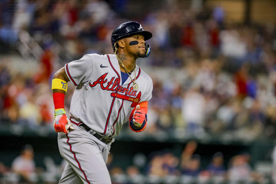 Atlanta Braves batter Ronald Acuña Jr. jogs the bases after hitting a home run in the top of the second inning of a baseball game against the Texas Rangers in Arlington, Texas, Monday, May 15, 2023. (AP Photo/Gareth Patterson)