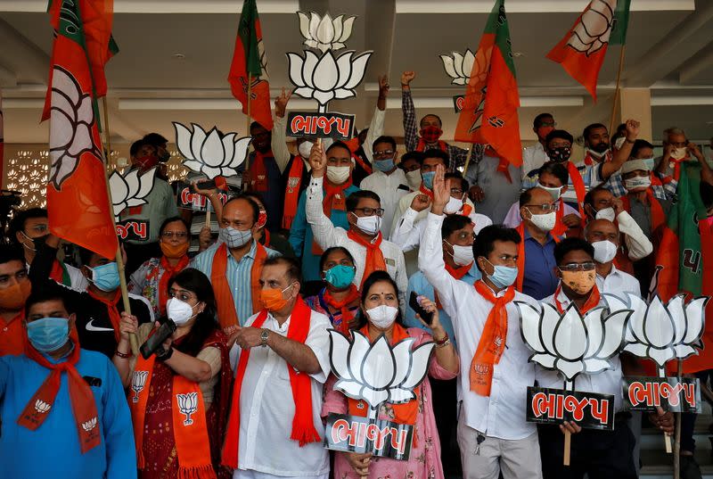 BJP supporters celebrate after initial poll results in Gandhinagar