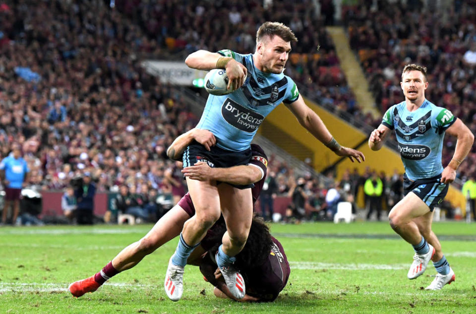 Angus Crichton of the Blues takes on the defence during game one of the 2019 State of Origin series. (Photo by Bradley Kanaris/Getty Images)