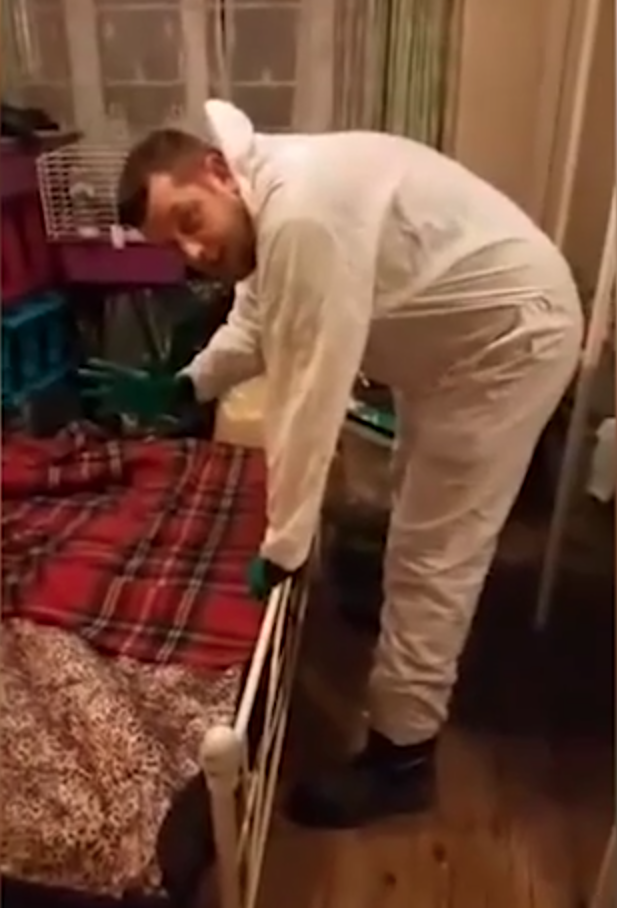 Pest controller Peter starts pulling the sheets off the bed. Photo: Facebook