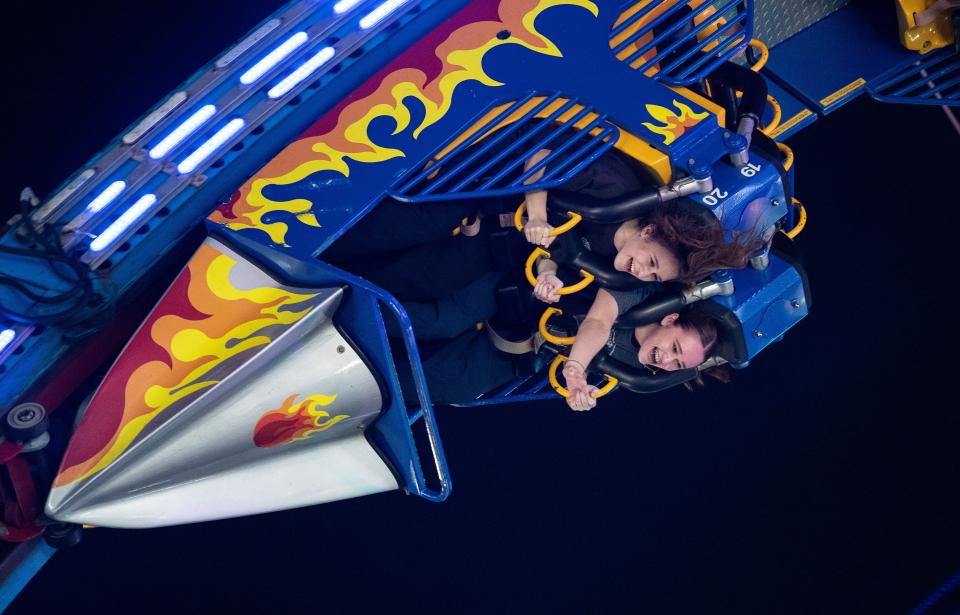 Myia Babak and Julie Stupak ride the Fireball at the Southwest Florida Ag Expo on Thursday, Feb. 29, 2024 at the Lee County Civic Center Complex in North Fort Myers.