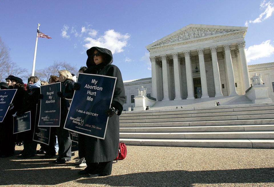Demonstrators stand in front of the U.S. Supreme Court on Jan. 18, 2005 in Washington, D.C.  Norma McCorvey along with the Justice Foundation are petitioning the Supreme Court to reverse its decision in Roe v. Wade.