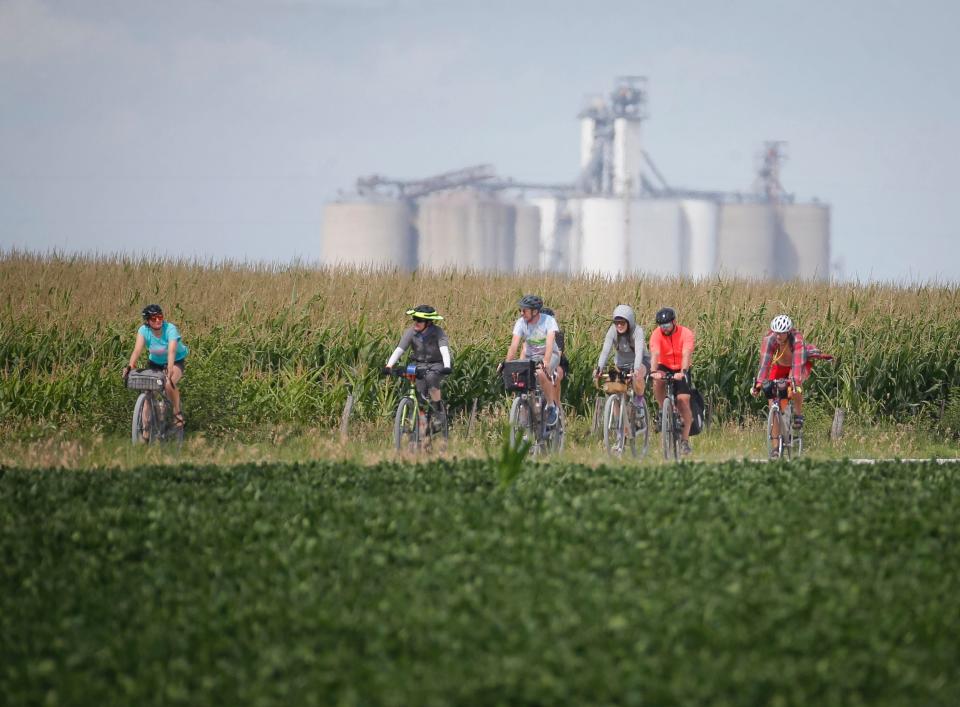 Cyclists ride the optional gravel route to West Bend on Tuesday during RAGBRAI.