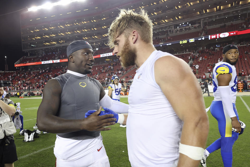 San Francisco 49ers wide receiver Deebo Samuel, left, shakes hands with Los Angeles Rams wide receiver Cooper Kupp after an NFL football game in Santa Clara, Calif., Monday, Oct. 3, 2022. (AP Photo/Jed Jacobsohn)