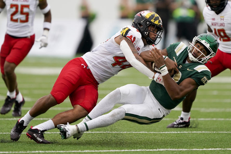 Charlotte quarterback Xavier Williams is tackled by Maryland linebacker Caleb Wheatland during the first half of an NCAA college football game on Saturday, Sept. 10, 2022, in Charlotte, N.C. (AP Photo/Chris Carlson)