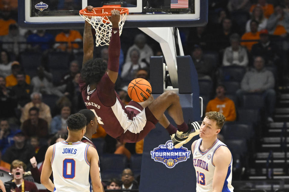 Mississippi State guard Cameron Matthews (4) dunks as Florida forward Aleks Szymczyk (13) and guard Myreon Jones (0) look on during overtime of an NCAA college basketball game in the second round of the Southeastern Conference tournament, Thursday, March 9, 2023, in Nashville, Tenn. Mississippi State won 69-68. (AP Photo/John Amis)