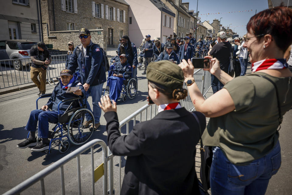 CORRECTS LOCATION U.S. veterans parade during a gathering in preparation of the 79th D-Day anniversary in Sainte-Mere-Eglise, Normandy, France, Sunday, June 4, 2023. The landings on the coast of Normandy 79 year ago by U.S. and British troops took place on June 6, 1944. (AP Photo/Thomas Padilla)