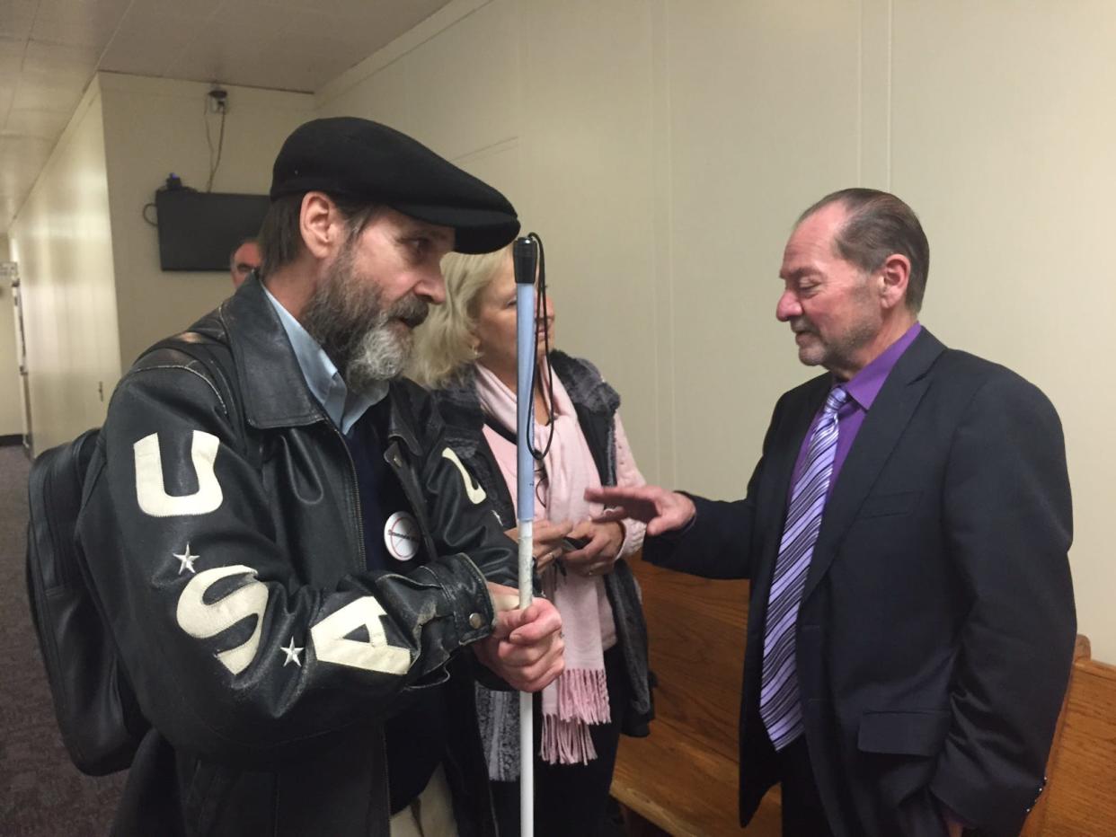 Joe Harcz (left) and his attorney Brian Kamar during a hearing on Oct. 16, 2015 at Lansing district court. Harcz is a blind activist who was arrested at a Sept. 17, 2015 at a Americans with Disabilities celebration at the Michigan Capitol in Lansing.