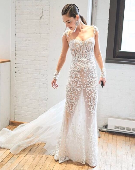 Bride wearing transparent naked sheer wedding gown