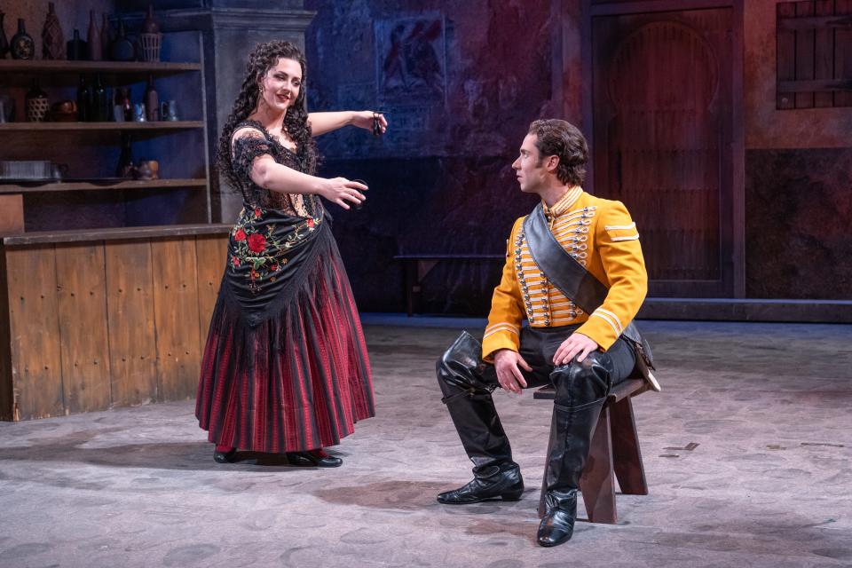 Chelsea Laggan, left, as the title character in “Carmen” teases the soldier Don José played by Victor Starsky in the Sarasota Opera’s new production of the Georges Bizet classic.