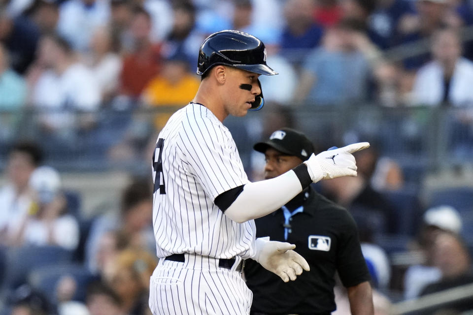 New York Yankees' Aaron Judge gestures to teammates after hitting a single during the first inning of a baseball game against the Tampa Bay Rays Tuesday, Aug. 1, 2023, in New York. (AP Photo/Frank Franklin II)