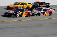 TALLADEGA, AL - OCTOBER 23: Kurt Busch, driver of the #22 Shell/Pennzoil Dodge, and Regan Smith, driver of the #78 Furniture Row Companies Chevrolet, races side by side with Kasey Kahne, driver of the #4 Red Bull Toyota, and Brian Vickers, driver of the #83 Red Bull Toyota, during the NASCAR Sprint Cup Series Good Sam Club 500 at Talladega Superspeedway on October 23, 2011 in Talladega, Alabama. (Photo by Jeff Zelevansky/Getty Images for NASCAR)