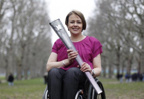 Baroness Tanni Grey-Thompson from Wales, one Great Britain's most successful disabled athletes; poses with the torch which will be used for the 2012 Paralympic Games in Green Park, central London, February 29, 2012.