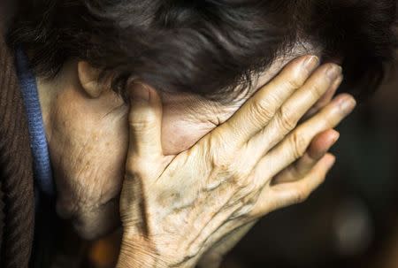 A woman takes part in a prayer service for Reverend Hyeon Soo Lim, inside a chapel at the Light Korean Presbyterian Church in Mississauga, March 9, 2015. REUTERS/Mark Blinch