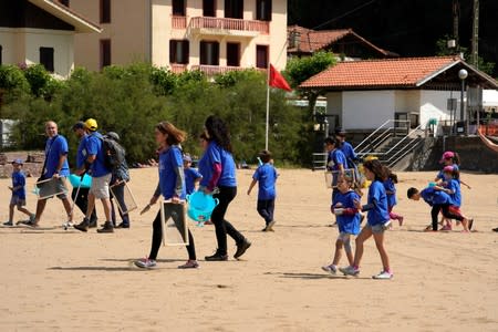 Volunteers take part in the Zero Plastiko Urdaibai ocean and coastal cleanup on Laida beach near Bermeo