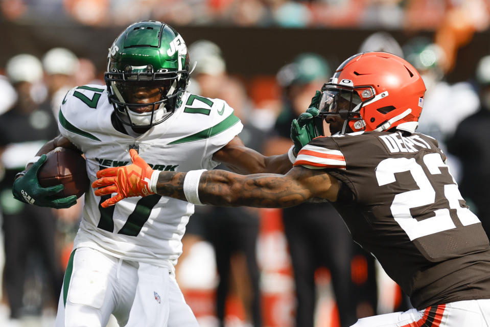 New York Jets wide receiver Garrett Wilson tries to break away from Cleveland Browns safety Grant Delpit (22) during the second half of an NFL football game, Sunday, Sept. 18, 2022, in Cleveland. The Jets won 31-30. (AP Photo/Ron Schwane)