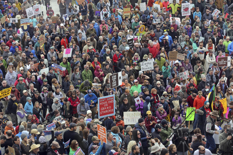 FILE - In this Dec. 2, 2017, file photo, supporters of the Bears Ears and Grand Staircase-Escalante National Monuments gather during a rally, in Salt Lake City. A federal judge has rejected the Trump administration's bid to dismiss lawsuits challenging the constitutionality of a 2017 decision to downsize two sprawling national monuments in Utah. (AP Photo/Rick Bowmer, File)