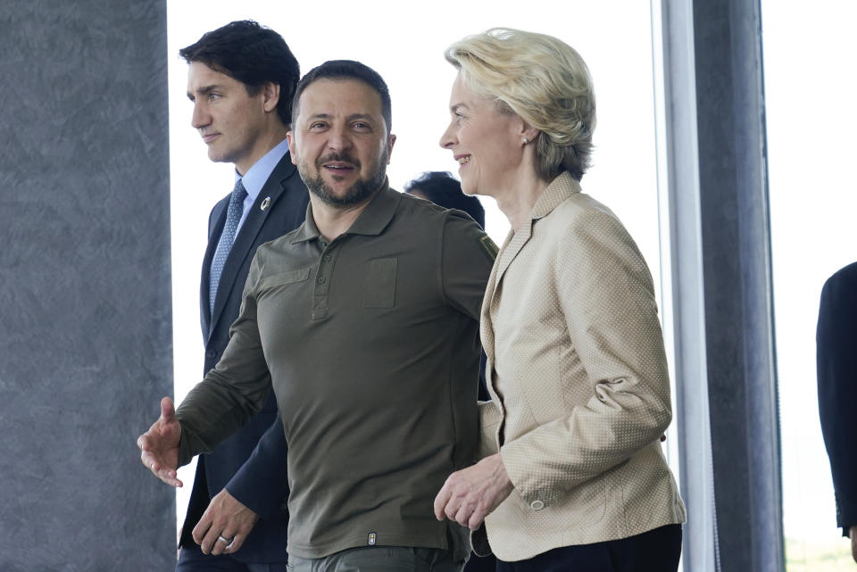 European Commission President Ursula von der Leyen, right, and Ukrainian President Volodymyr Zelenskyy, center, talk as they walk with Canadian Prime Minister Justin Trudeau, left, prior to a working session on Ukraine during the G7 Summit in Hiroshima, western Japan, Sunday, May 21, 2023. (AP Photo/Susan Walsh, POOL)