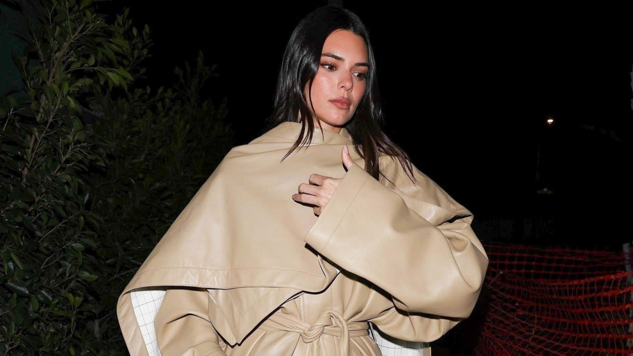  Kendall Jenner wearing a Phoebe Philo tan leather trench coat. 