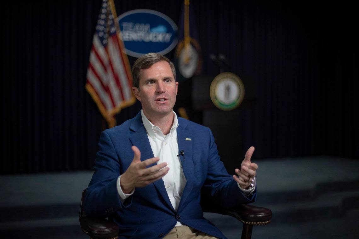 Kentucky Gov. Andy Beshear speaks to a reporter at the state Capitol in Frankfort on Wednesday, Dec. 7, 2022.