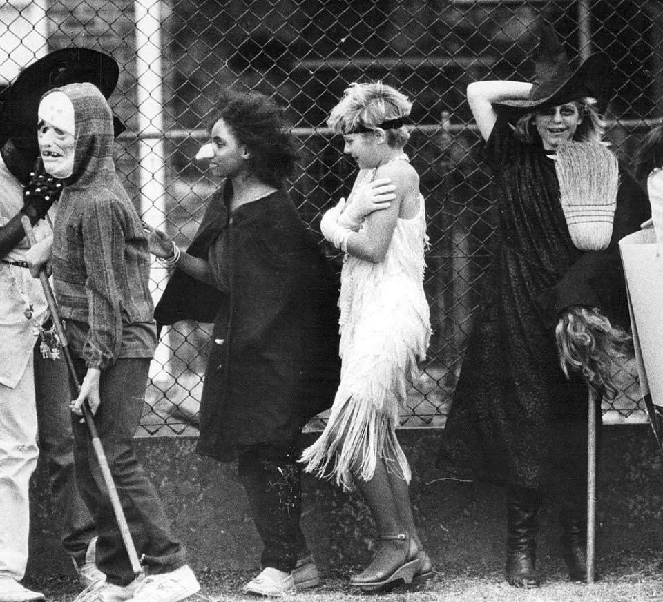 <p>Children line up outside Park Will Elementary in Denver, waiting for their Halloween parade to start. While many schools staged Halloween parades at school during the '80s and '90s, the tradition has <a href="http://fusion.net/story/213138/milford-connecticut-schools-ban-halloween/" rel="nofollow noopener" target="_blank" data-ylk="slk:come under fire in more recent years;elm:context_link;itc:0;sec:content-canvas" class="link ">come under fire in more recent years</a> due to concerns about students being left out due to religious or cultural beliefs. </p>