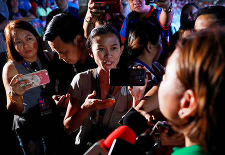 Rappler reporter Pia Ranada interviews Davao City Mayor Sara Duterte, the eldest daughter of President Rodrigo Duterte, after a campaign sortie in Calamba City, Laguna, Philippines, March 9, 2019. Picture taken March 9, 2019. REUTERS/Eloisa Lopez