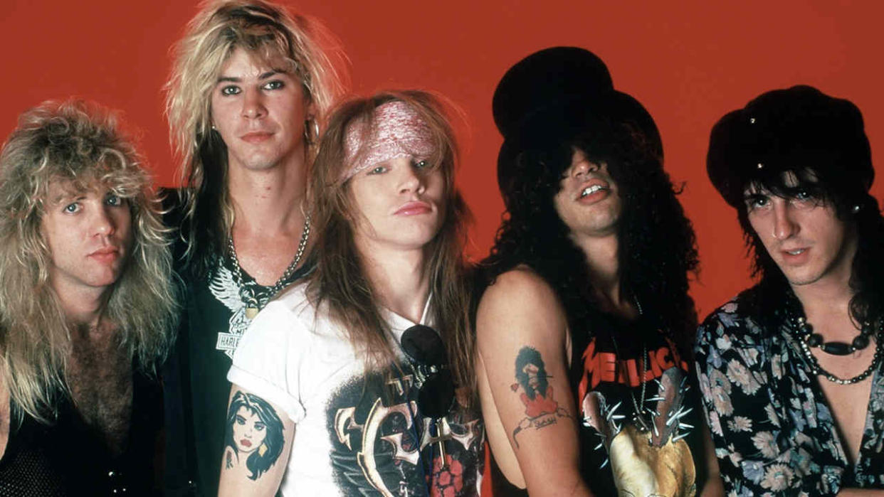  The classic line-up of Guns N’ Roses against a red background 