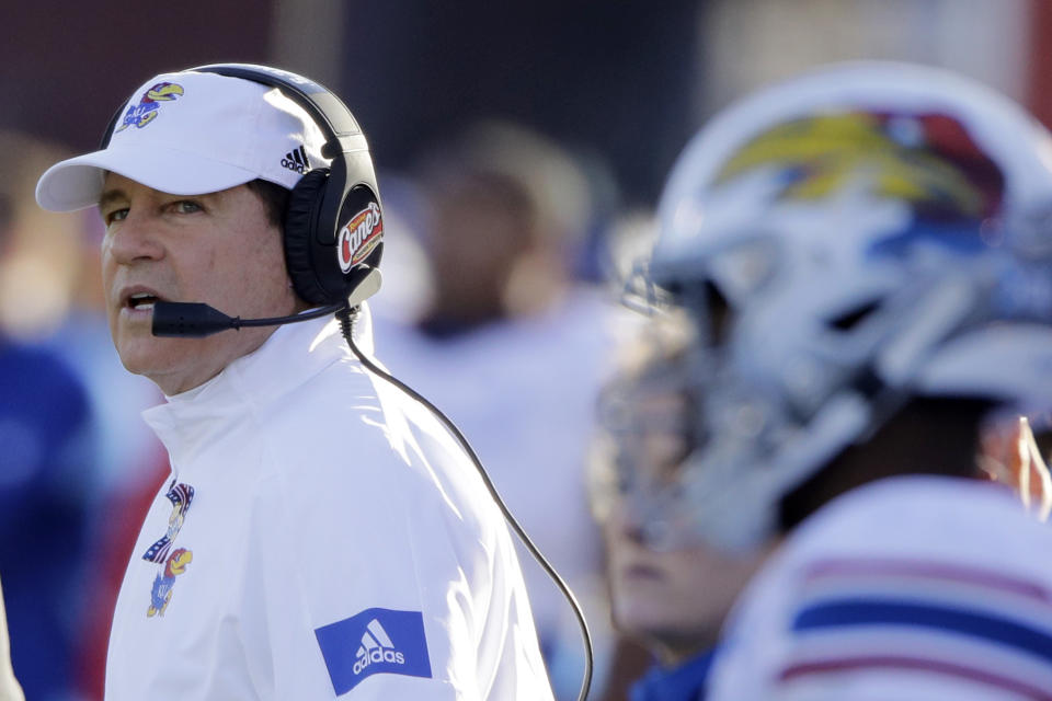 Kansas head coach Les Miles watches from the sidelines during the first half of an NCAA college football game against Baylor Saturday, Nov. 30, 2019, in Lawrence, Kan. (AP Photo/Charlie Riedel)