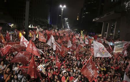 Supporters of Brazil's President and Workers' Party (PT) presidential candidate Dilma Rousseff react to the results of the Brazil general elections on Sao Paulo's Paulista Avenue, October 26, 2014. REUTERS/Nacho Doce