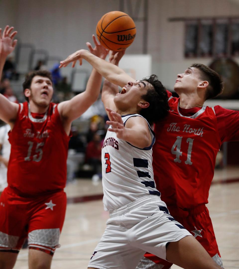 Tulare Western's Malachi Ficher gets contact but no call against North during their 72nd annual Polly Wilhelmsen Invitational Basketball Tournament championship game in Visalia, Calif., Saturday, Dec. 30, 2023.