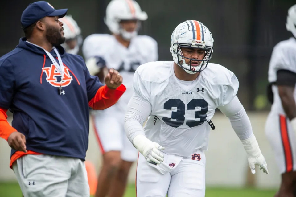 Auburn Tigers defensive lineman Mosiah Nasili-Kite (33) runs drills during Auburn Tigers football practice at the Woltosz Football Performance Center at in Auburn, Ala., on Monday, April 3, 2023.