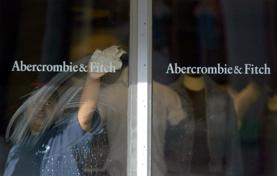 A window washer cleans the door of the Abercrombie and Fitch store in Manhattan' s South Street Seaport,  Tuesday, May 17, 2005 in New York.  Abercrombie & Fitch is expected to release earnings after the market close on Tueesday. (AP Photo/Mary Altaffer)