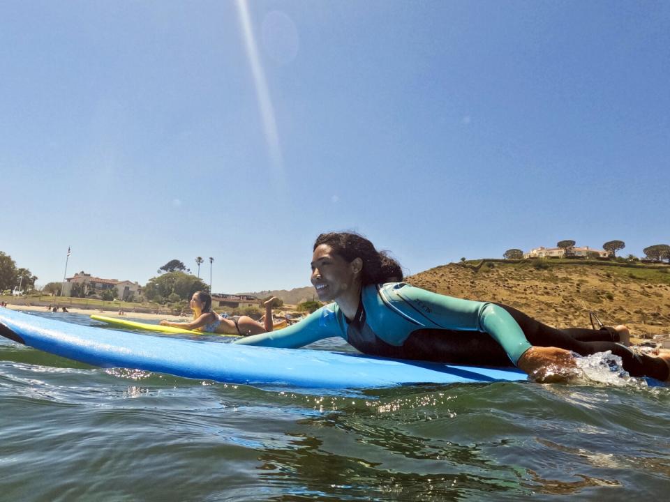 Isabel De Leon paddles out to a wave during a Los Courage Camp event at First Point.