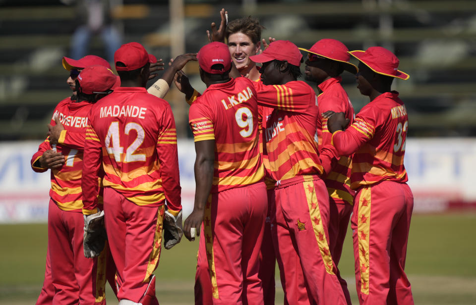 Zimbabwean players celebrate the wicket of Bangladesh batsman Tamim Iqbal on the final day of the One-Day International cricket match between Zimbabwe and Bangladesh at Harare Sports Club in Harare, Zimbabwe, Wednesday, Aug, 10, 2022. (AP Photo/Tsvangirayi Mukwazhi)