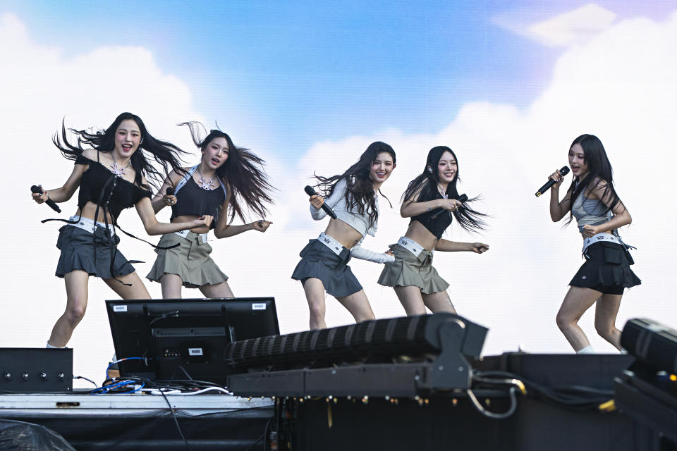 Minji, Hyein, Danielle, Hanni, and Haerin of NewJeans perform at the Lollapalooza Music Festival in August 2023, at Grant Park in Chicago.