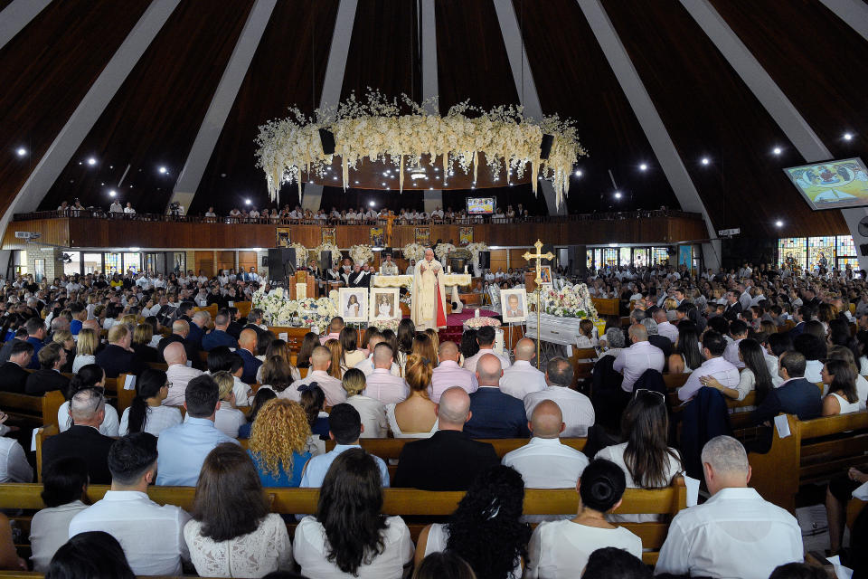 The photographs and coffins of Antony Abdallah, 13, Angelina Abdallah, 12, and Sienna Abdallah, 8, are seen during their funeral on Monday. Source: AAP