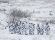 Ukrainian service members are seen during drills with NLAW missiles in the Lviv region