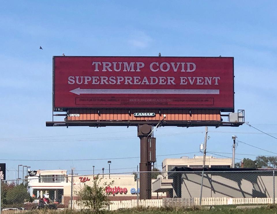 The political group Rural America 2020 said it paid to post this digital billboard near the entrance to the Des Moines International Airport before President Donald Trump's rally there, scheduled for Oct. 14, 2020.