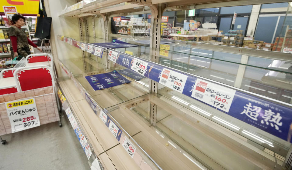 Shelves are empty at a supermarket in Tateyama, Chiba prefecture, near Tokyo as Typhoon Hagibis approaches Friday, Oct. 11, 2019. A powerful typhoon is forecast to bring up to 80 centimeters (31 inches) of rain and damaging winds to the Tokyo area and Japan's Pacific coast this weekend, and the government is warning residents to stockpile necessities and leave high-risk places before it's too dangerous. (Naoya Osato/Kyodo News via AP)