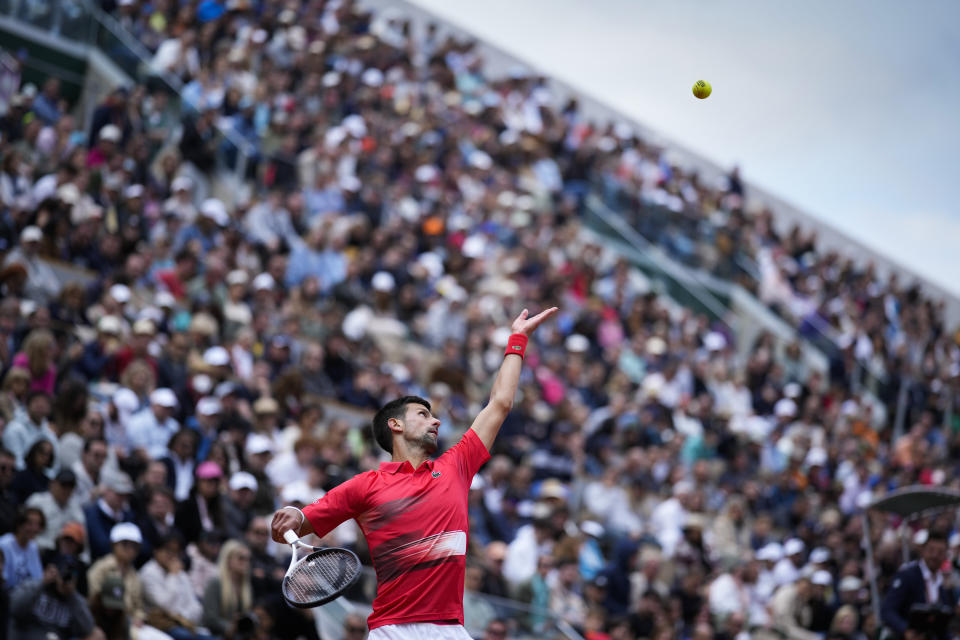 Serbia's Novak Djokovic serves against Argentina's Diego Schwartzman during their fourth round match at the French Open tennis tournament in Roland Garros stadium in Paris, France, Sunday, May 29, 2022. (AP Photo/Christophe Ena)