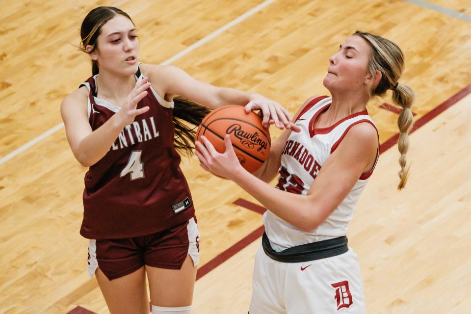 Dover's Josee Werntz and Wheeling Central Catholic's Mariah Ratcliffe fight for possession during a game, Thursday, Feb. 1 at Dover High School.